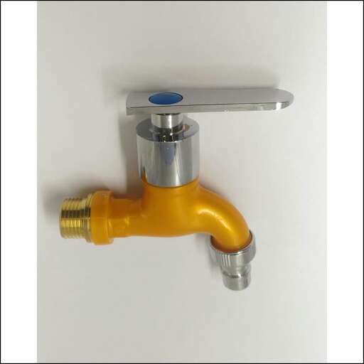 a faucet in a white wall