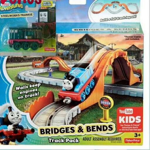 a toy train and cars on a toy train track.