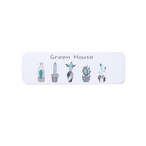 a white plate with a green plant and plants on it.