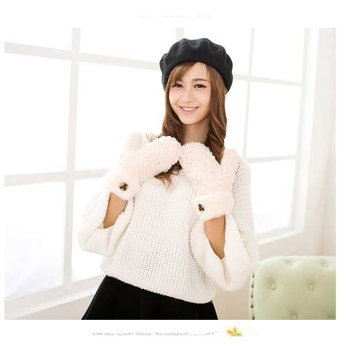 a girl in a hat and gloves
