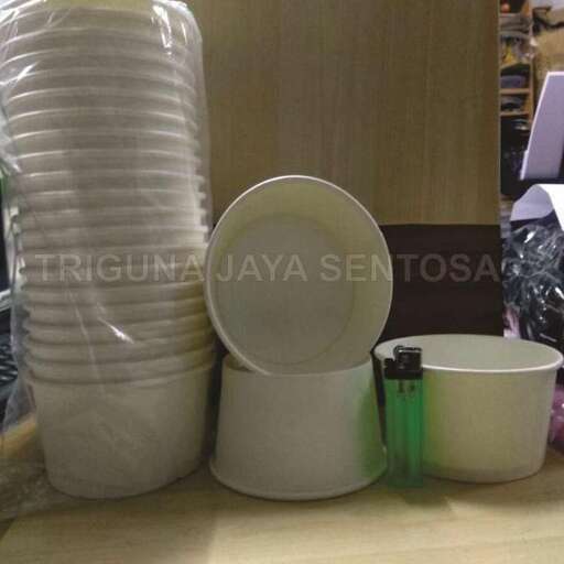 a stack of cups and cups on a table.