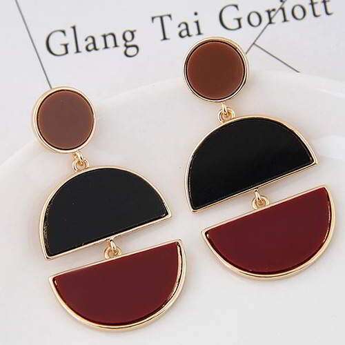 a pair of earrings with a black and red glass and a gold plated base.