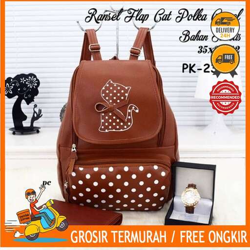 a bag that is made of leather and a cat on a bag.