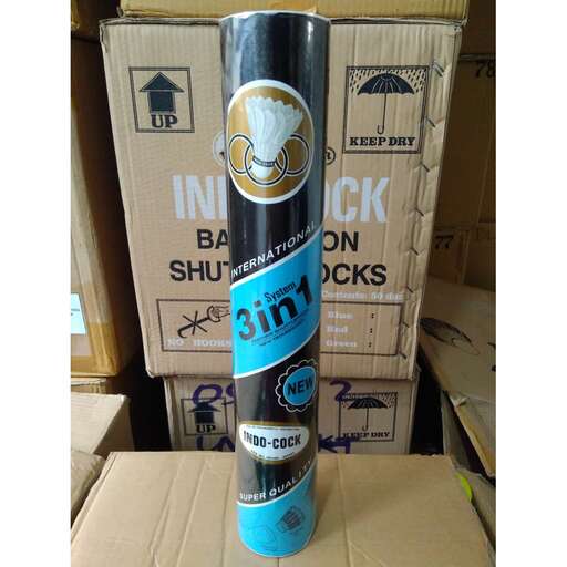 a bottle of beer on top of a cardboard box.