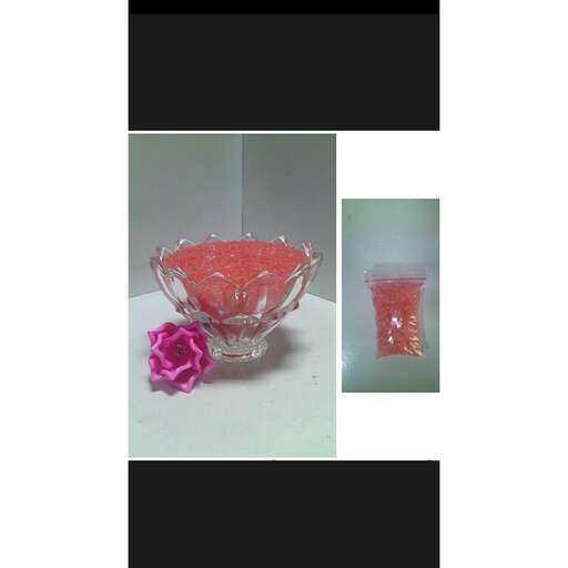 a glass bowl with a rose in it.