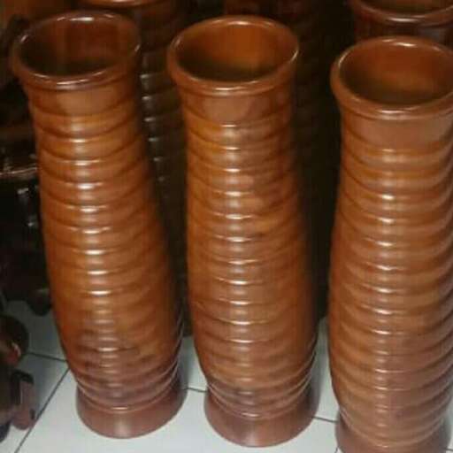 a stack of brown pottery.