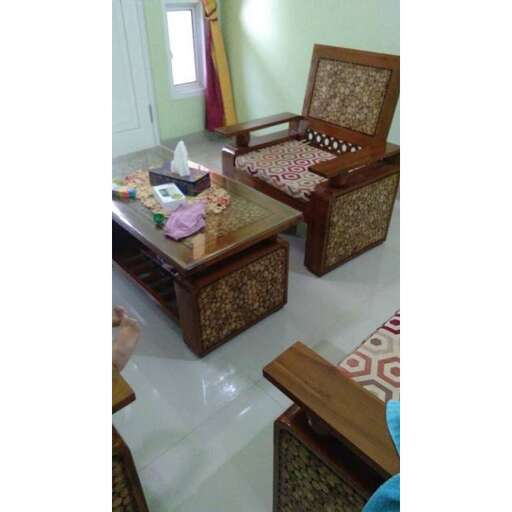 a living room with a wooden table and chairs.