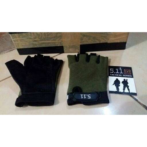 a pair of gloves and gloves sitting on a counter.