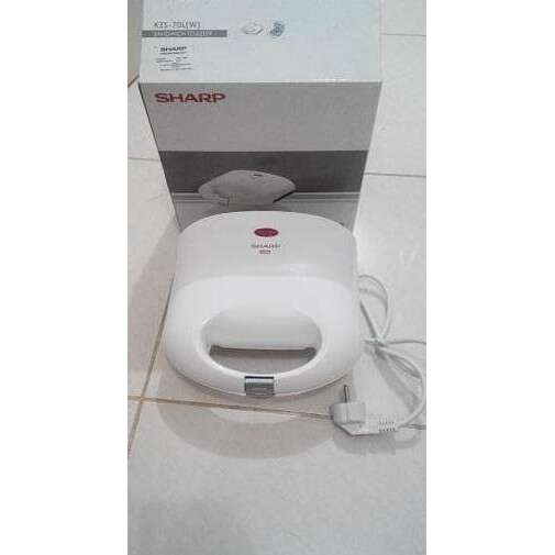 a white electric box sitting on the floor.