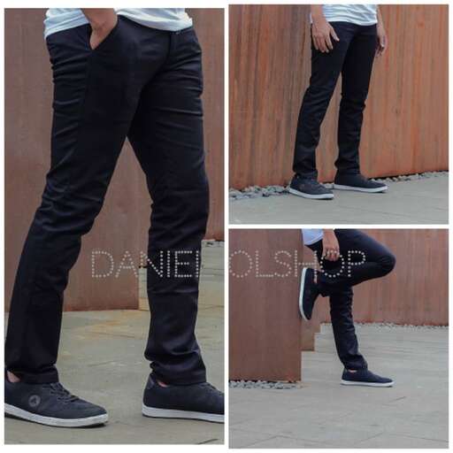 a man in black jeans and a white t - shirt