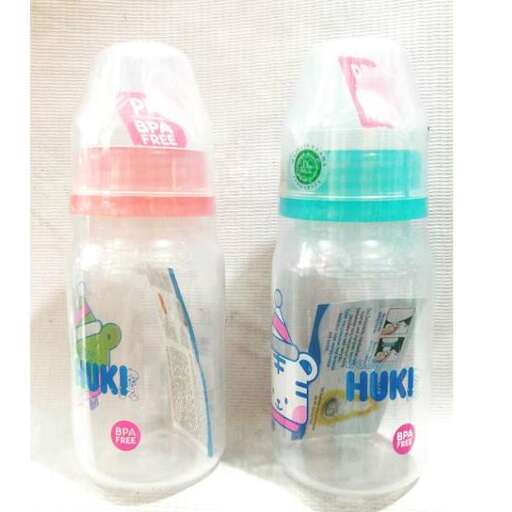 a bottle of baby's toothpaste with a blue lid.