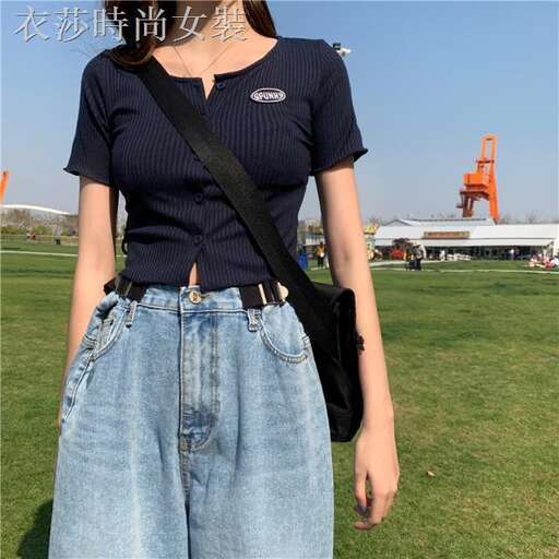 a pair of jeans with a black bag.