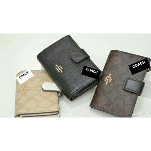 a small wallet with a small pocket on the front and a small wallet in the middle.