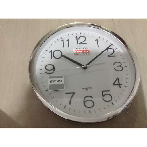 a clock that is on a table with a clock on it.