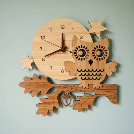 a wooden clock with a skull and a wooden frame.