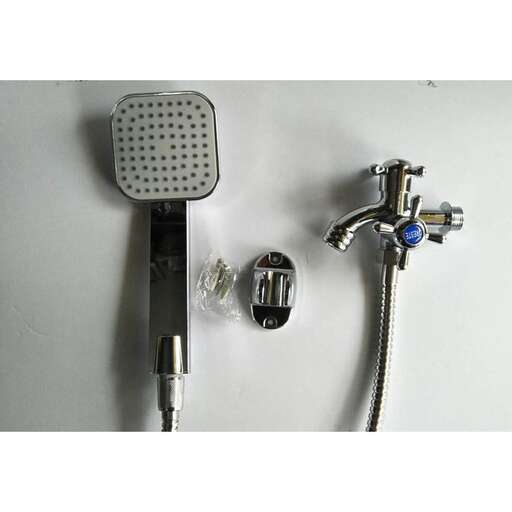 a shower head and a faucet on a wall.