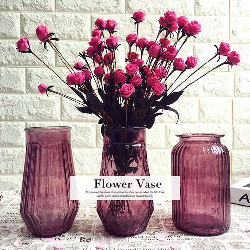 three vases with flowers on a table.