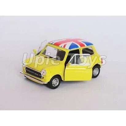 a small yellow car with a beach umbrella in the front.