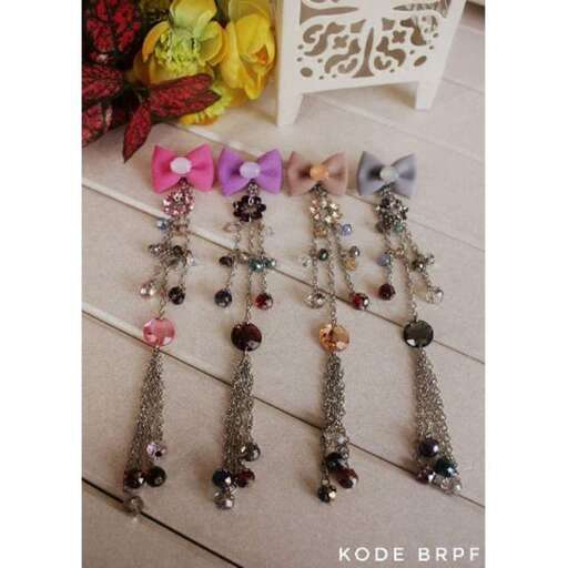 a set of three silver and pink glass beads, with a pink flower in the center.