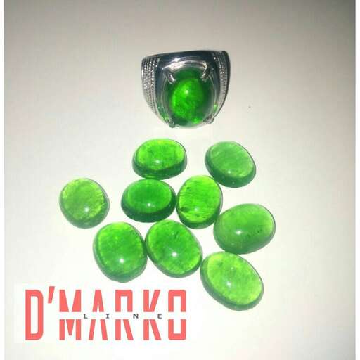 green glass beads in a glass jar