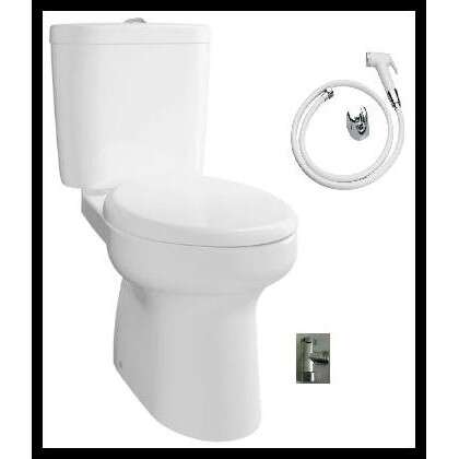 a white toilet sitting next to a white wall.
