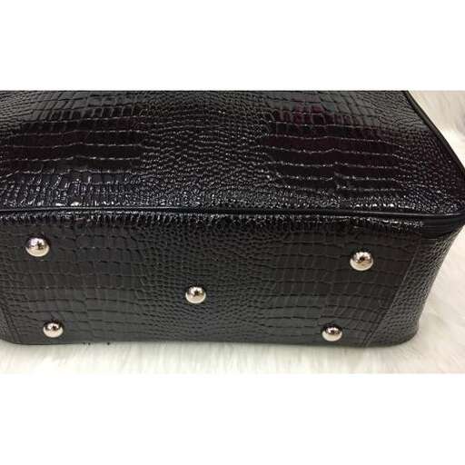 the bag is made of leather and is made from % handbags.