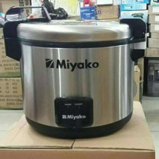 a large metal food processor with a lid.