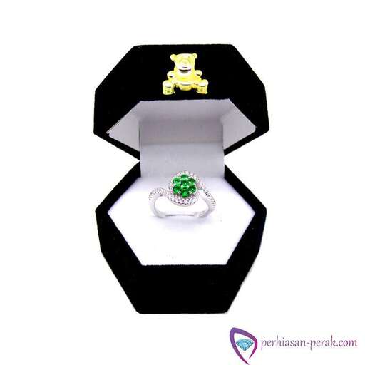 a ring with a diamond and emerald