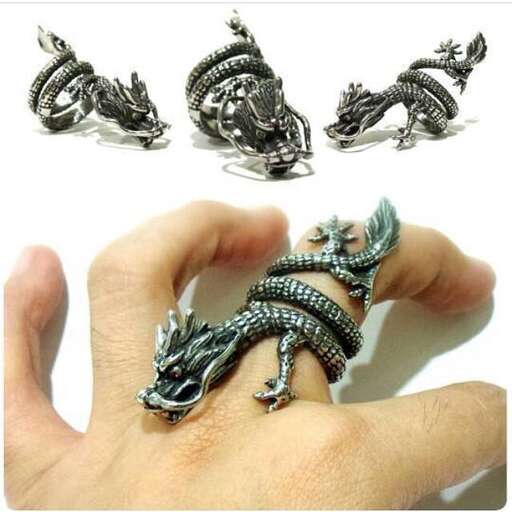 a silver bracelet with a dragonfly on it.