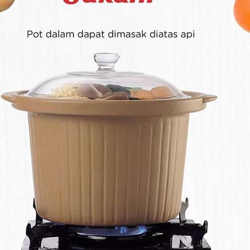 a pot with a lid on a stove top.
