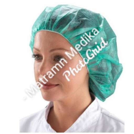 a woman with a surgical mask on her head