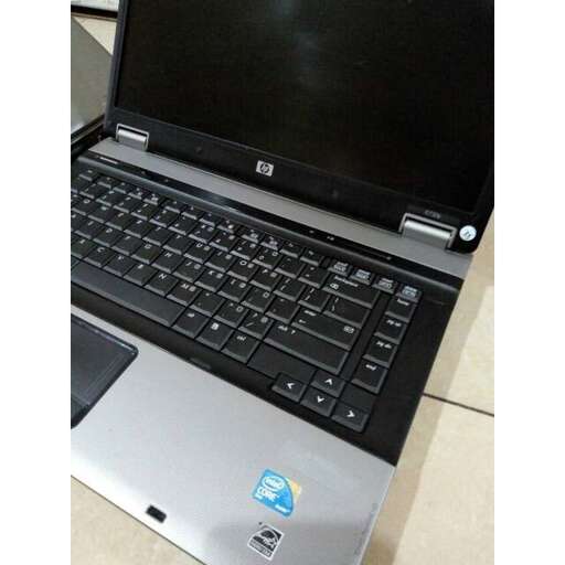 a laptop computer sitting on top of a table.