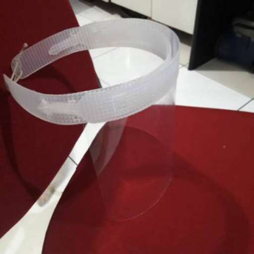 the ribbon is cut into a piece of plastic.