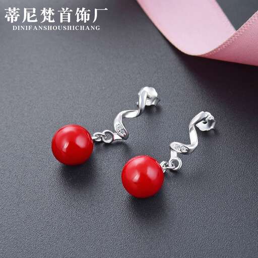 a pair of red glass beads