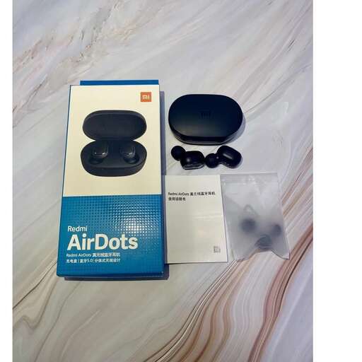 a box with a box of black buttons and a box of black buttons.