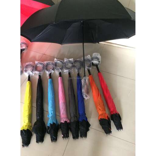 a bunch of umbrellas that are lined up.