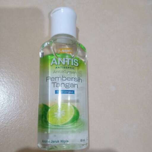 a bottle of soap sitting on a counter.