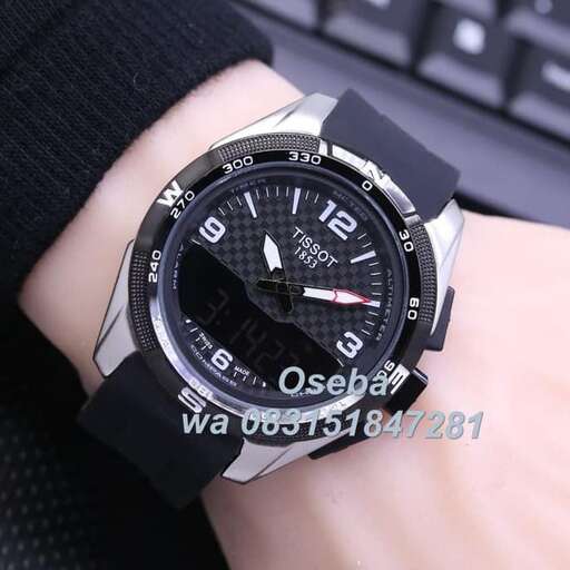the watch is made of plastic and the black strap is the watch.