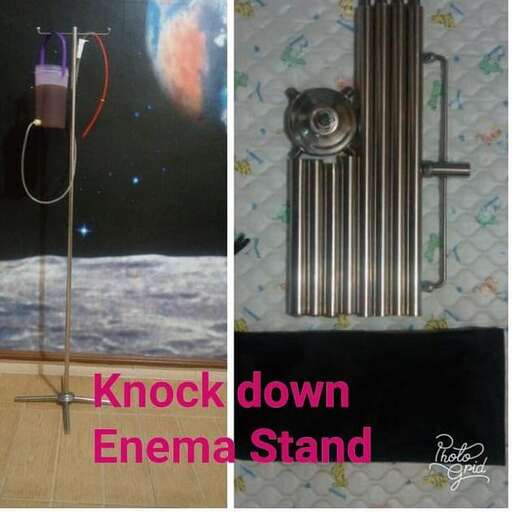 a metal object with a metal stand and a pipe.