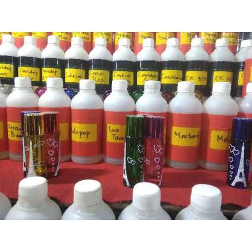 a collection of bottles of various colors.