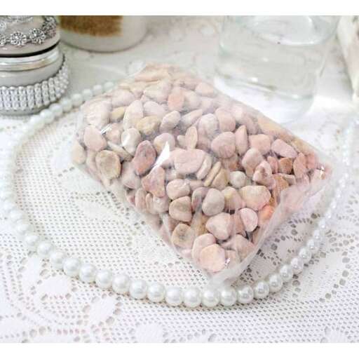 a glass jar filled with nuts and a glass jar.