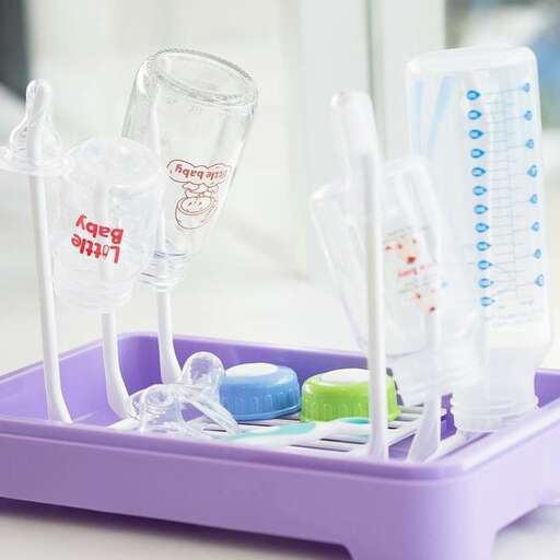 a purple tray with toothbrushes and glasses.