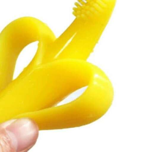 a hand holding a yellow plastic scissors.