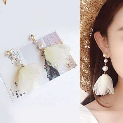 a hat and earrings made from a recycled paper