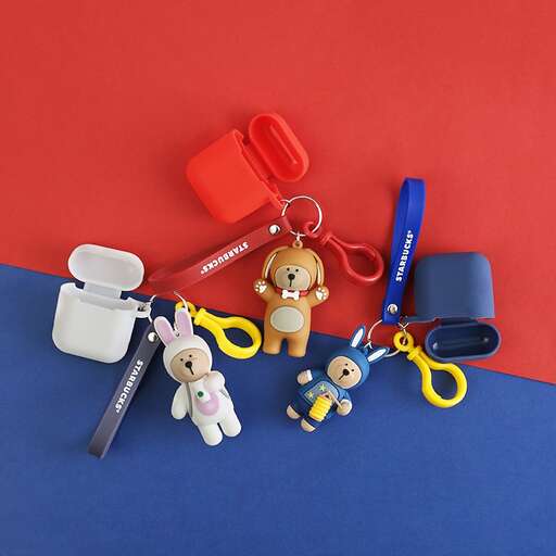 a group of small stuffed animals and a pair of scissors