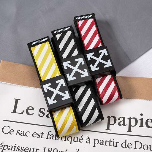 a set of three buttons with a white stripe and stripes on them.