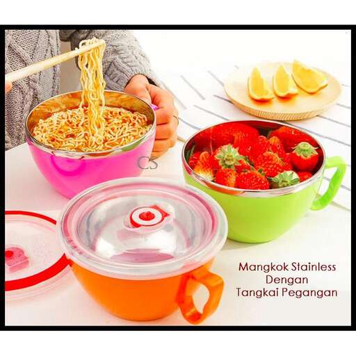 a woman is holding a bowl of food with strawberries.