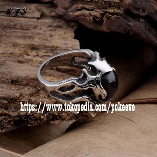 a ring made of sterling silver and a skull and a skull.