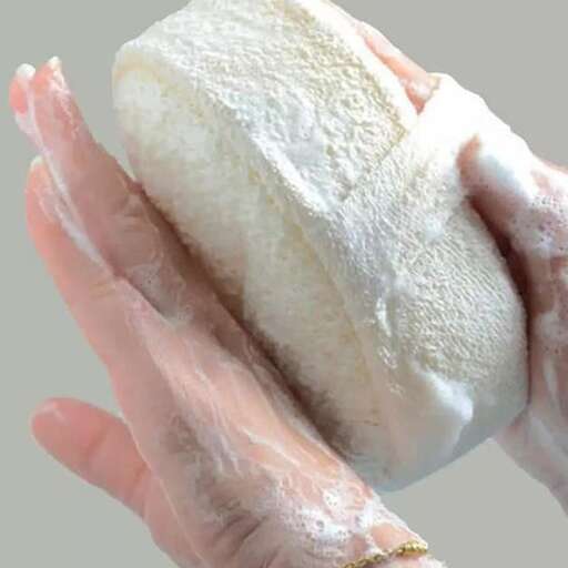 a woman holding a sand bag in her hands.