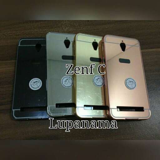 three cell phones are shown on a table.
